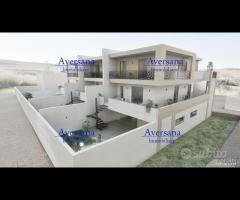 Villa a schiera moderna con porticato