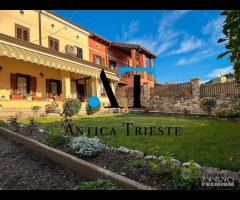 Villetta a schiera - con giardino