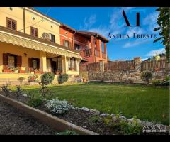 Villa a schiera - con giardino