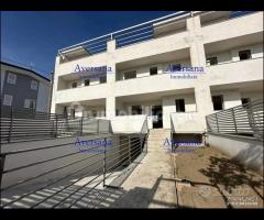 Ville a schiera con solarium