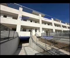 Ville a schiera con solarium