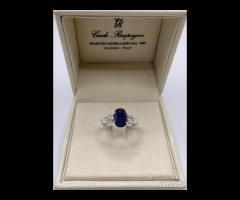 ANELLO ORO 18kt. CON DIAMANTI E ZAFFIRO BLU OVALE