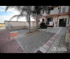 Appartamento a piano rialzato e garage